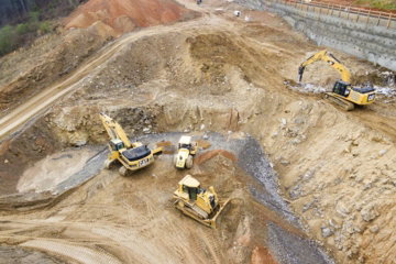 top-view-photography-of-four-heavy-equipment-on-quarry-at-daytime.jpg top view photography of four heavy equipment on quarry at daytime