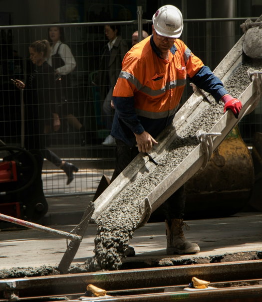 man-pouring-cements-on-road.jpg man pouring cements on road